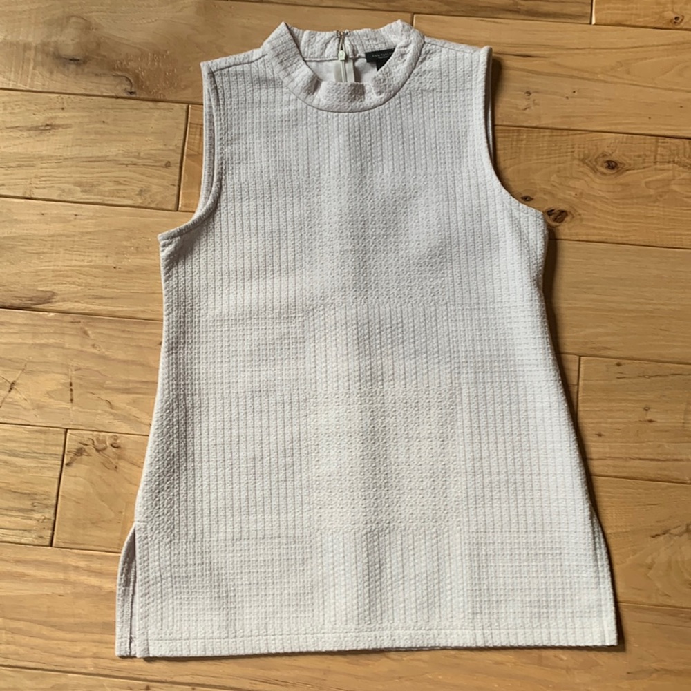 Cream sleeveless zippered neck top